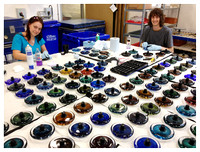 Erin Barr and Kalki Mansell bonding turned aluminium fittings to glass at National Glass Centre