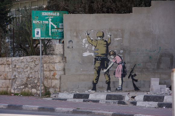 Graffiti on a wall by Banksy