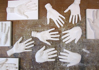 The beginning of the mould making process. Hand casts are taken in plaster of paris