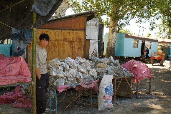 A man selling salt rock at a market in Kochkor
