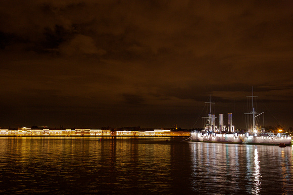 St Petersburg: Night view of the city over the Elba River with the Cruiser Aurora