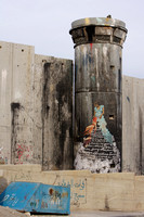 Grafitti on the dividing wall by Banksy