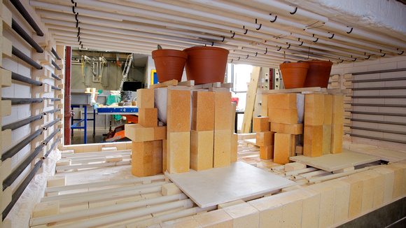 The crucibles & moulds are filled with the exact quantity of glass